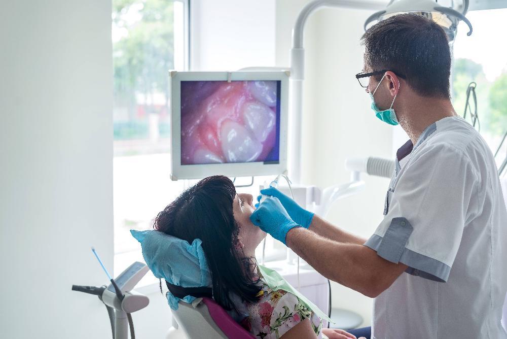 Dentist in Tampa FL performing gum disease treatment