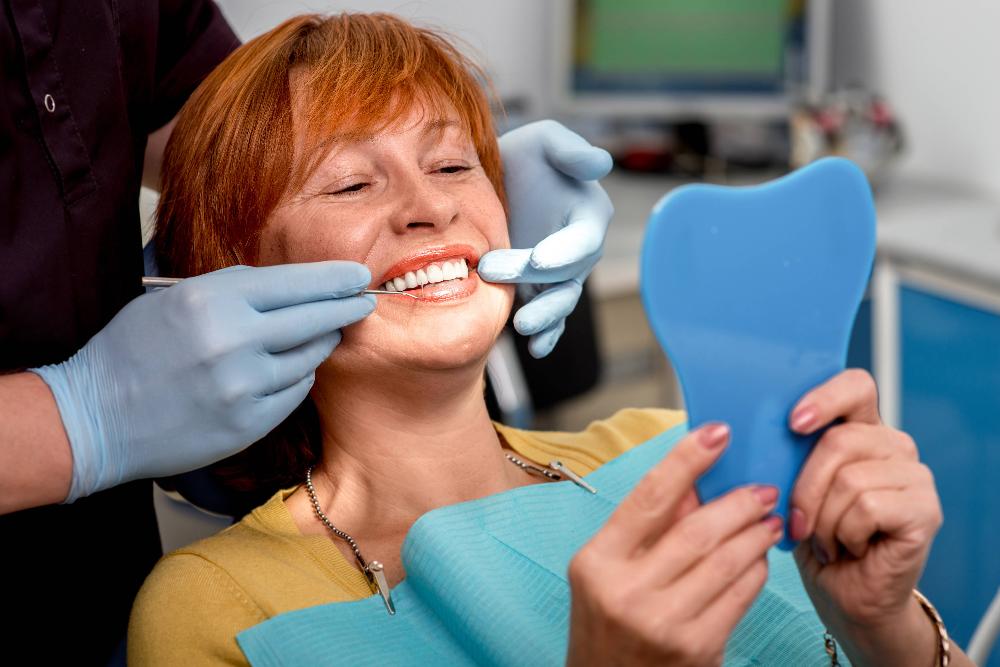 A middle aged female patient after a dental exam in Tampa, FL