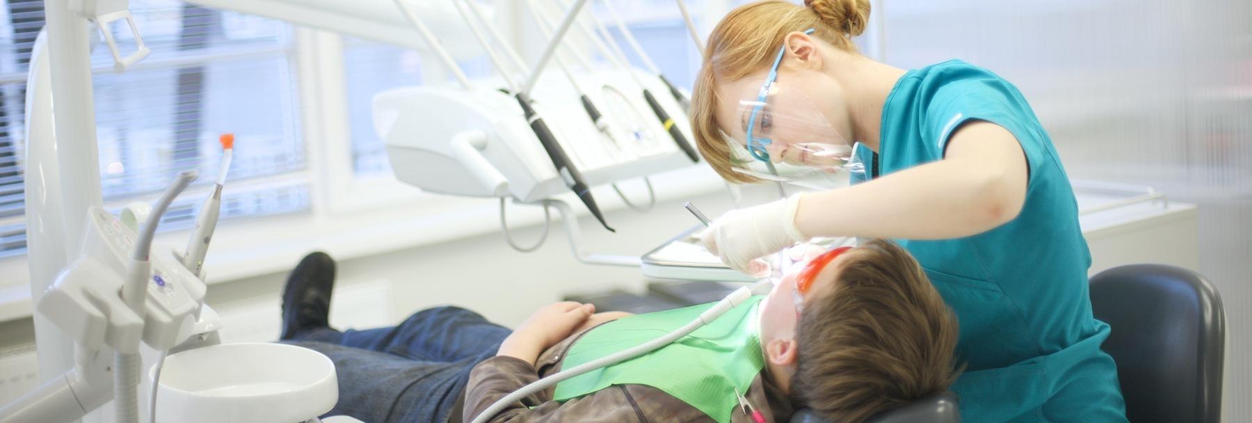 Child getting a dental examination in Tampa, FL