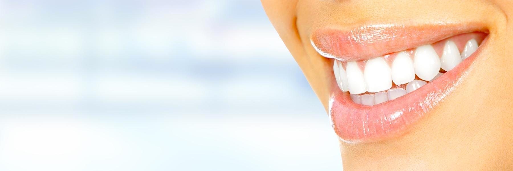 Lady smiling after damaged teeth repair at Carrollwood Village Dental