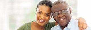 Father and daughter smiling after gum disease treatment in Tampa, FL