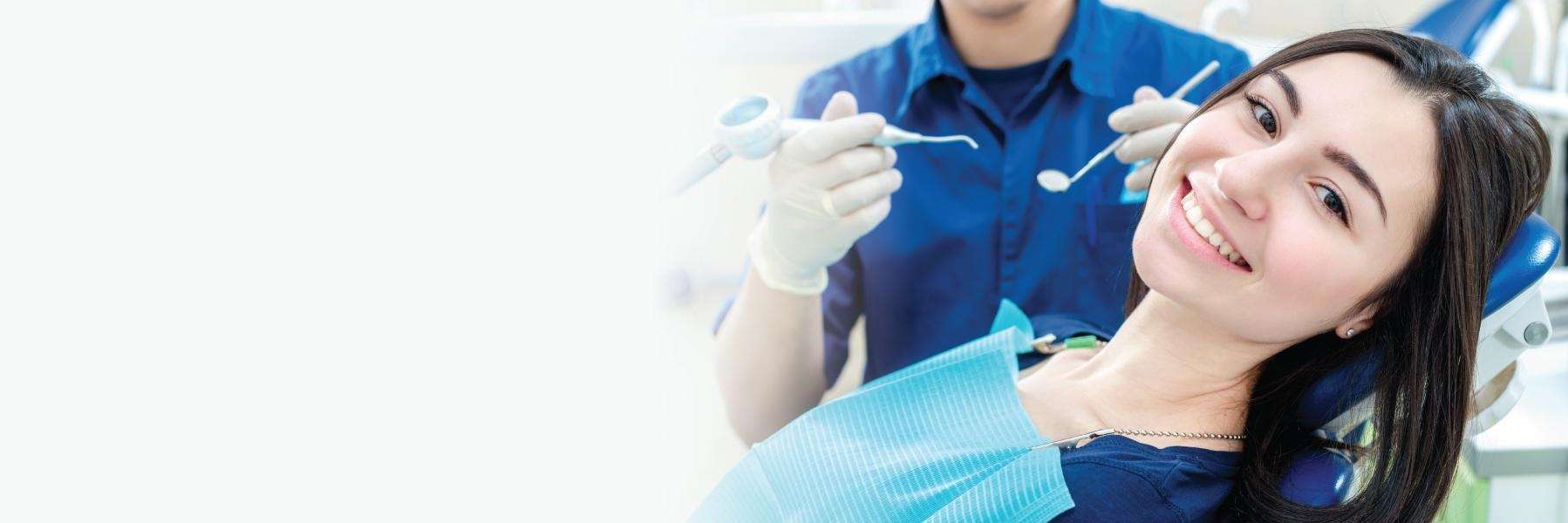 Woman receiving a dental examination in Tampa, FL