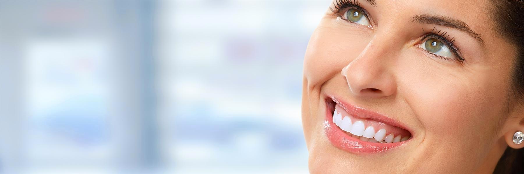 Woman smiling after emergency treatment in Tampa, FL