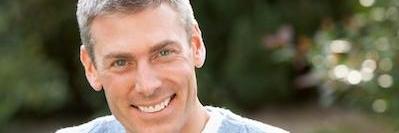 Man smiling after getting dentures in Tampa, FL