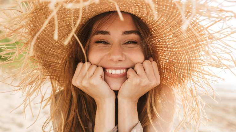 Lady smiling after getting dental crowns in Tampa, FL