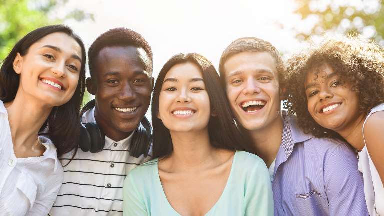 A diverse group of friend after getting a dental crowns in Tampa, FL