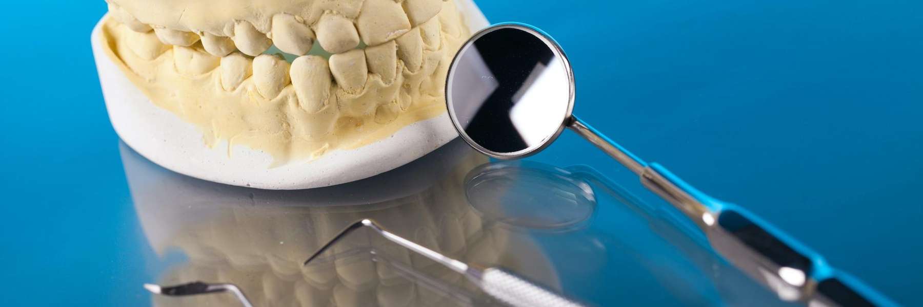 An illustration of dental crowns and dental extractors at Carrollwood Village Dental