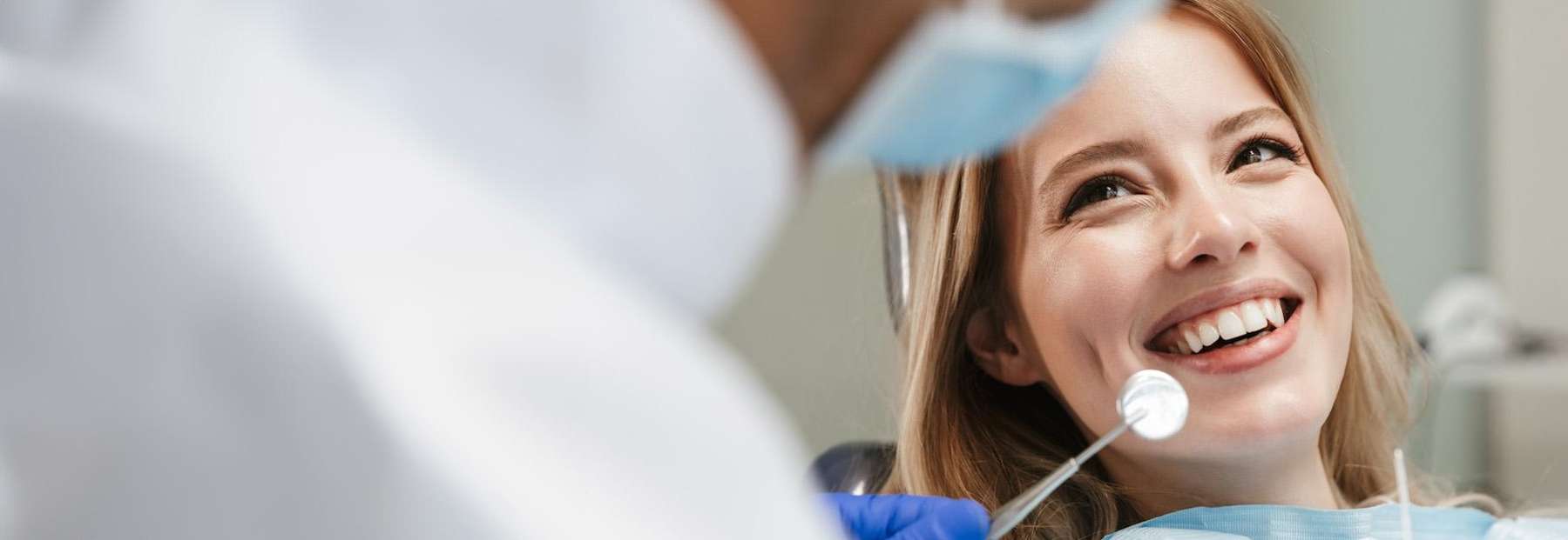 Patient smiling while getting dental crowns at Carrollwood Village Dental