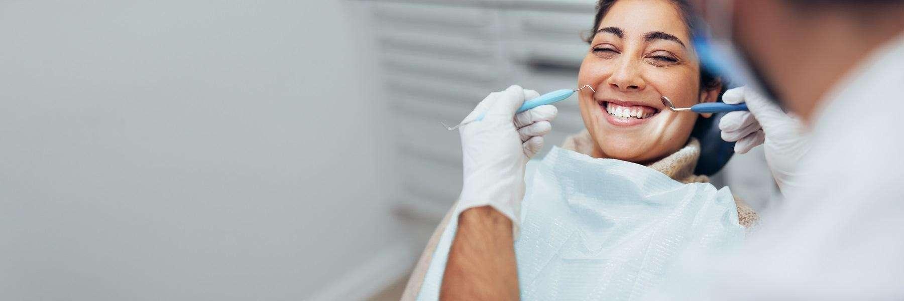  Lady smiling during gum disease treatment in Tampa, FL