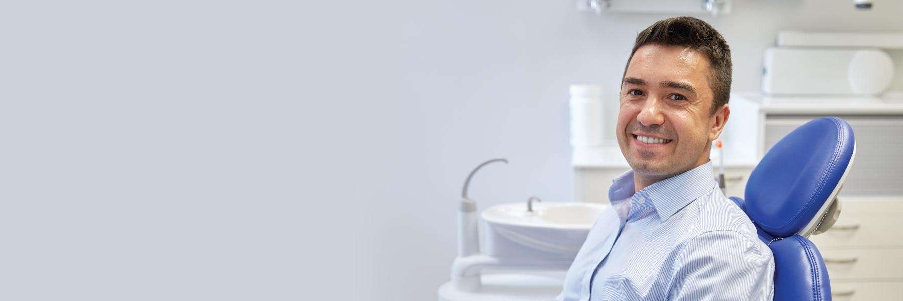 A patient smiling after getting a dental crown in Tampa, FL