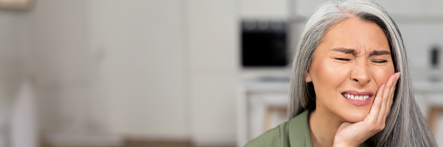 Woman waiting for emergency dental care near Tampa